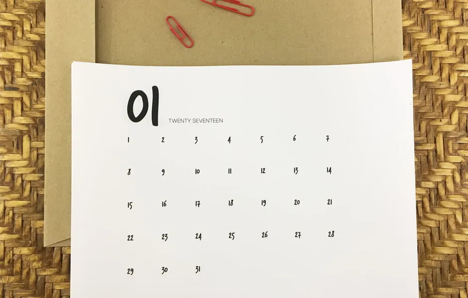 A blank version of the January calendar printable sitting on a table. 