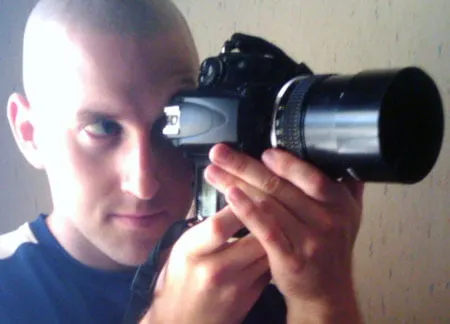 Bryan Cook shoots with his camera in hand. 