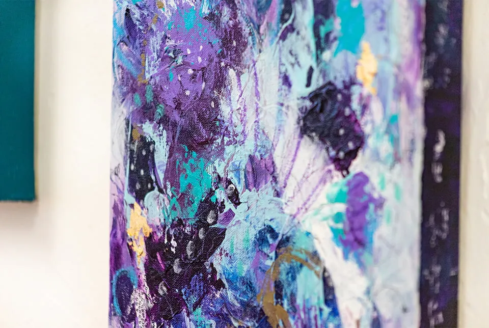 Hope from Ash - myheartcreative An up-close, angled shot of one of Aimee Eischen's abstract paintings. The painting has a variety of purple, blue, and black colors throughout.