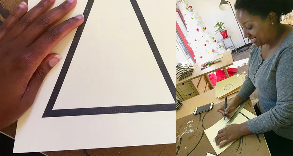 Nicole cuts out the stencil shapes using an exacto knife. 
