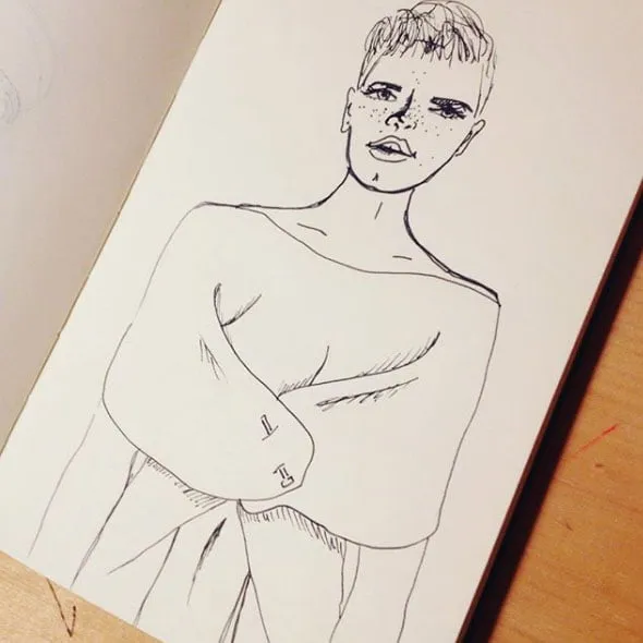 A sketch of a woman with short hair in pen. 