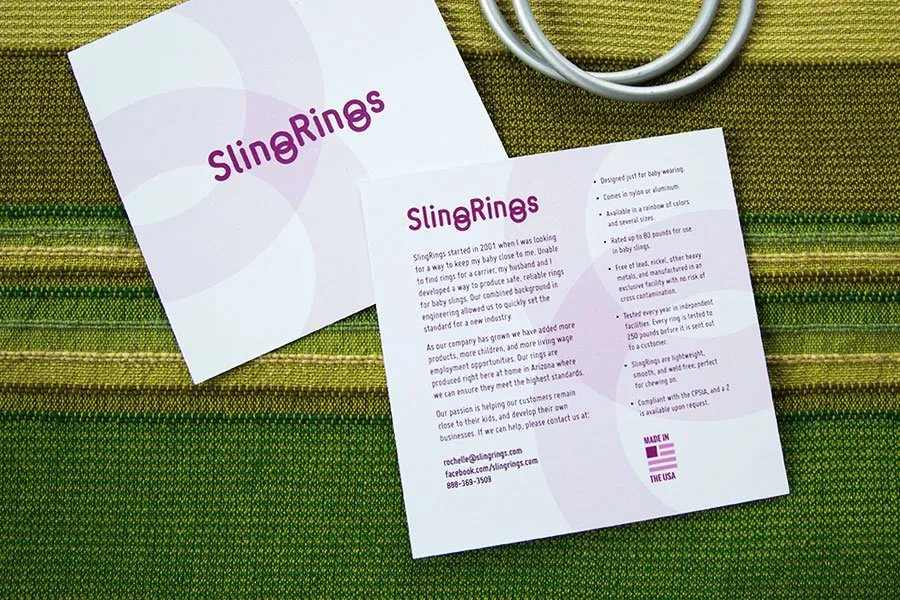 Thoughtful Design Will Make Your Business Better - myheartcreative The final postcard design for SlingRings. The front and back of the postcard are shown, lying on top of a green baby sling.