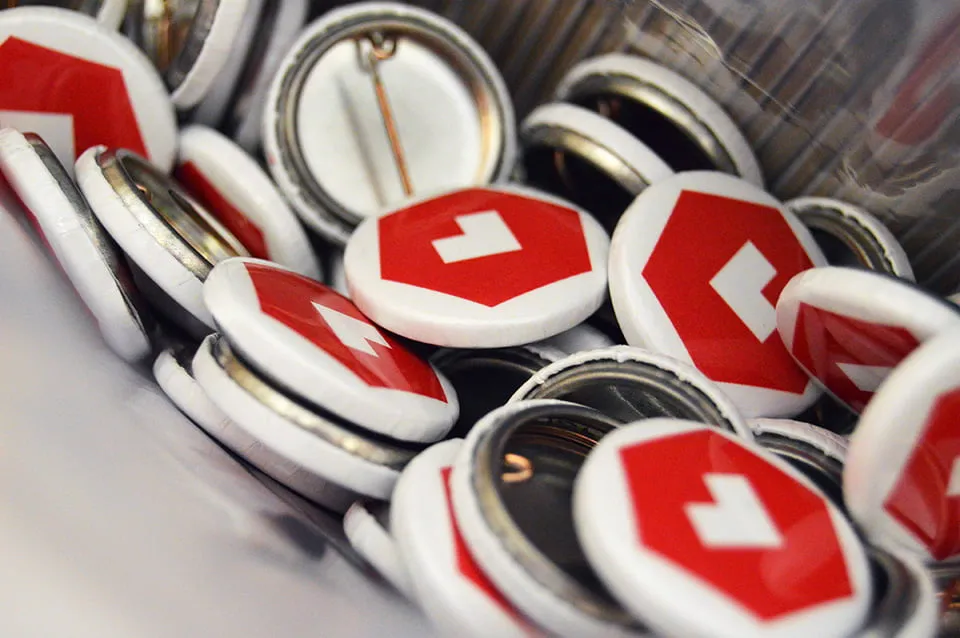 A pile of buttons with the myheartcreative logo icon. 