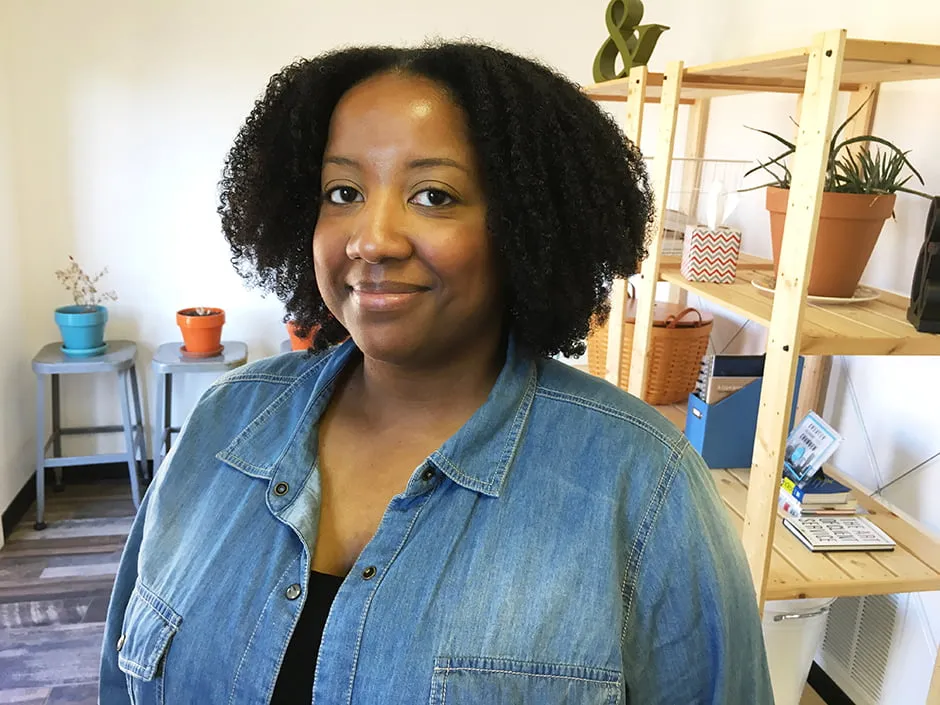 A professional headshot of Nicole Winn at the studio. 