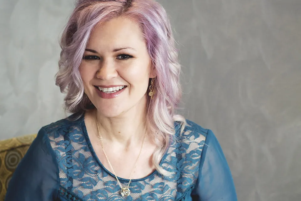 A myheartcreative photographer takes a headshot of a woman with light pink hair for Oklahoma photography services. 