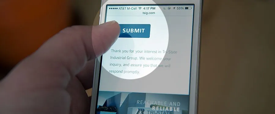 Make Your Website Communicate for You - myheartcreative A thumb hovers over a submit button on a mobile website. The button is circled with a spotlight, while the rest of the screen is shaded.