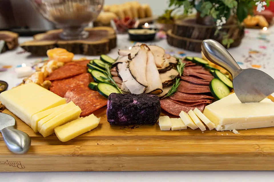 Our Clients Have Our Hearts - myheartcreative A charcuterie board with various meats and cheese on the table for the Client Appreciation Party.