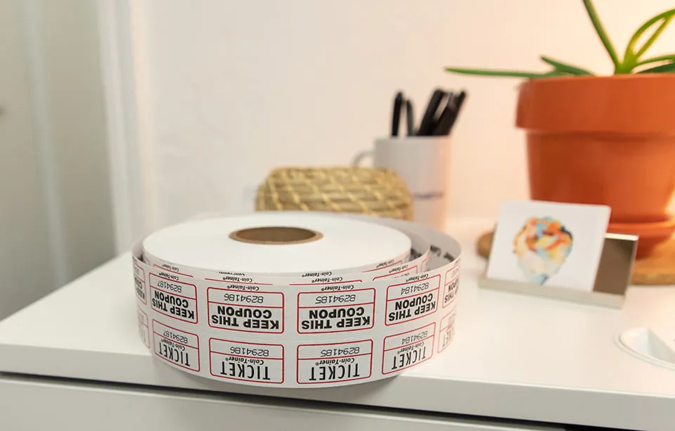 Our Clients Have Our Hearts - myheartcreative A roll of tickets sits on the conference room table for guests to entry th drawing for door prizes.
