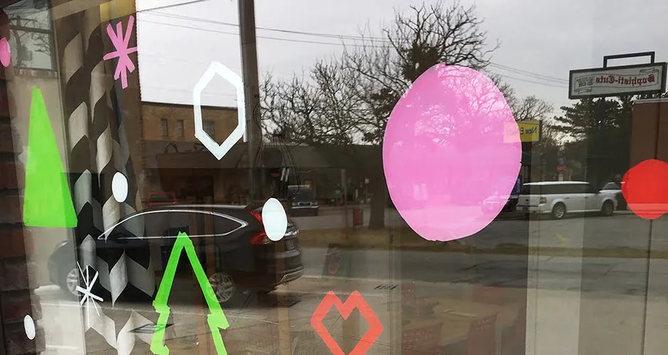 One of the studio windows from the outside. It is decorated with Christmas stencil art. 
