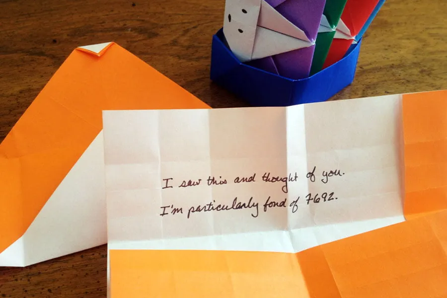 A note on the inside of the orange origami paper card reads, "I saw this and thought of you. I'm particularly fond of 7692." 