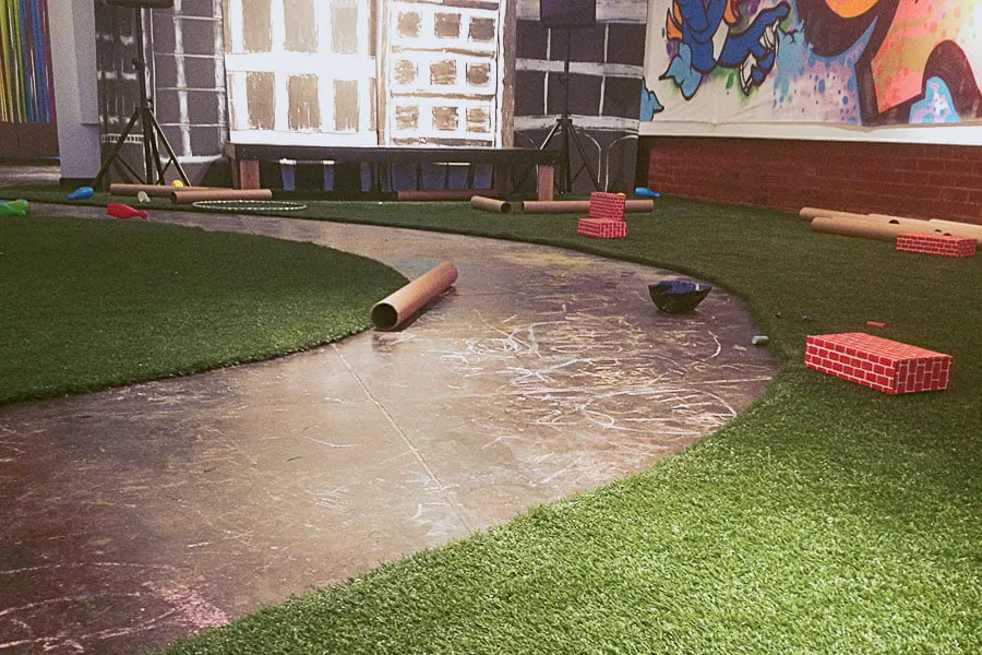 An indoor pathway at IAO art gallery is scribbled with chalk. 