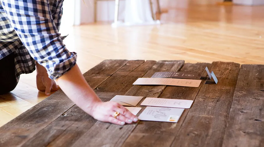 Styled Stationery - myheartcreative Amy places the stationary on a wooden background for the styled shoot.