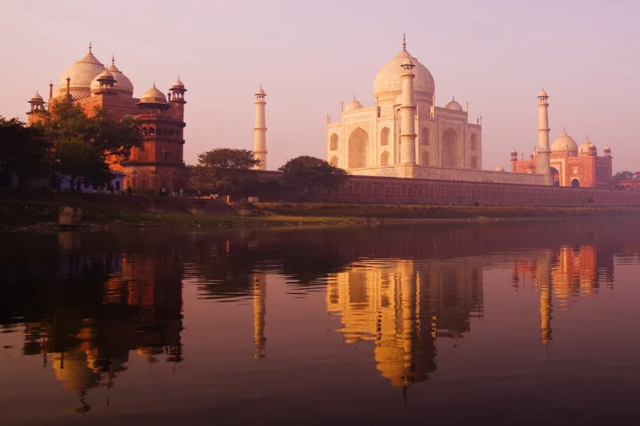 Taj Mahal or Slum Mahal? - myheartcreative The Taj Mahal overlooking a small body of water.