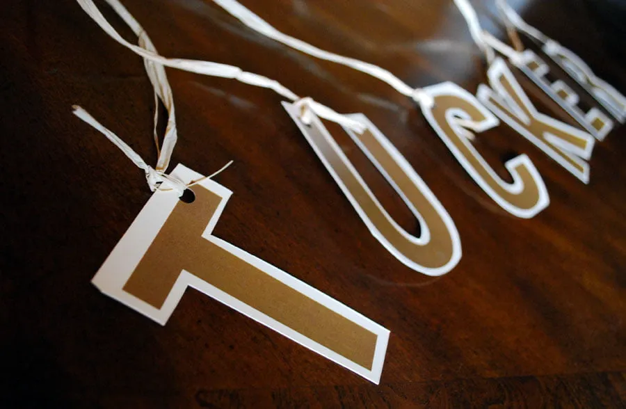 invite designs for adoption celebration - myheartcreative Cutouts of each letter in Tucker's name tied to a ribbon garland.