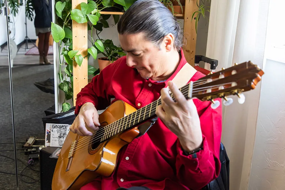 Our Clients Have Our Hearts - myheartcreative Musician Edgar Cruz plays the guitar at the Client Appreciation Party.