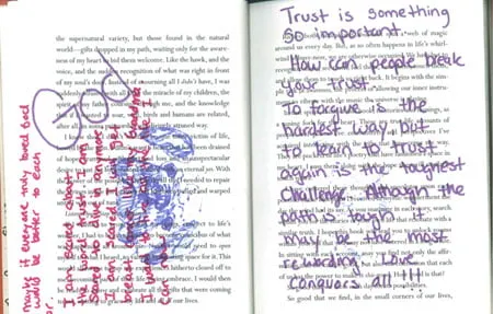 Two pages of the book filled with Amy's notes and doodles. On the left side, Amy wrote "God" in purple pen, along with other notes in red marker and a sketch in purple pen. On the right page, she wrote in purple pen, "Trust is something so important. How can people break your trust? To forgive is the hardest way, but to learn to trust again is the toughest challenge. Although the path is tough, it may be the most rewarding. Love conquers all!!!" 