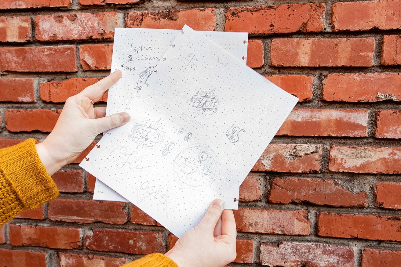 The hand-drawn sketches of the logo design OKC for OSLS. 
