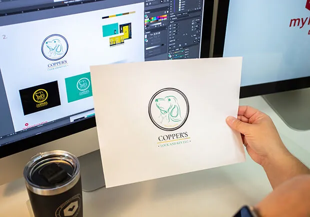 Designer showing client's logo