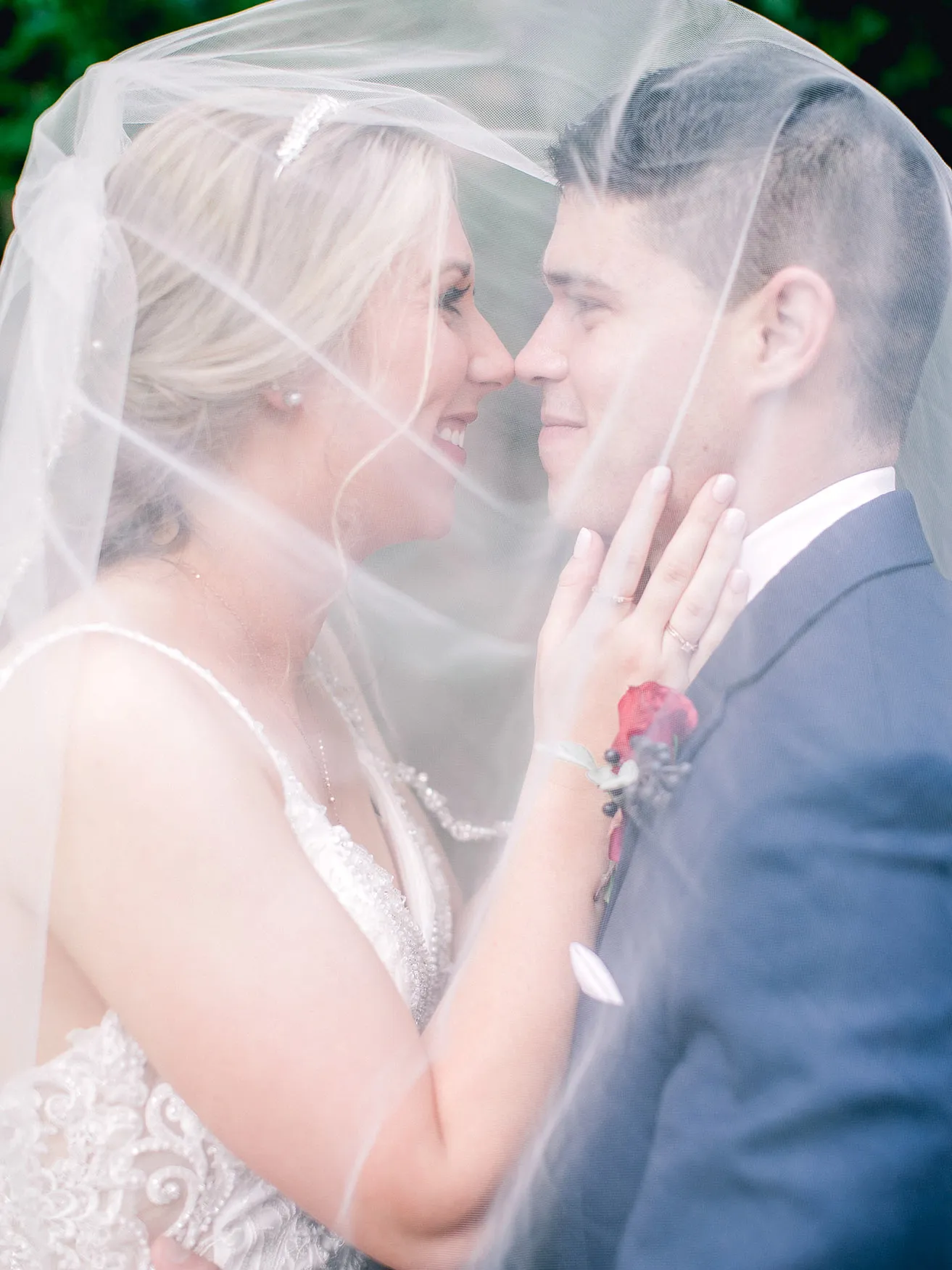 Derek and Shelby Thunderbird Chapel Wedding - myheartcreative Shelby lovingly touches Derek's face and smiles while both are underneath her veil.