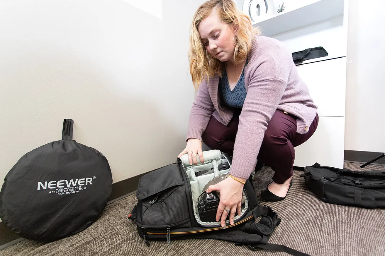 Hello Dallas! - myheartcreative Morgan packs away the camera and photography equipment into bags to prepare for a client photoshoot.