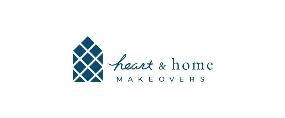 The logo for Heart and Home Makeovers. The font and logo icon are a dark blue color. 