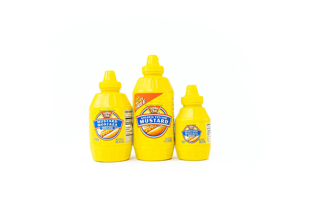 Why You Need OKC Commercial Photography - myheartcreative Three bottles of Garden Club mustard on a white background as shot during a Dallas commercial photography session.