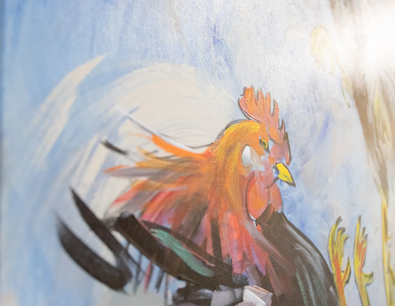 An up-close shot of a painting of a rooster as painted by Dr. Bob Palmer. 