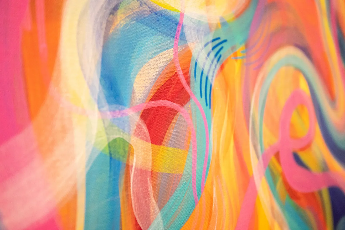 An up-close view of a multi-colored abstract painting by Chandler Domingos. 