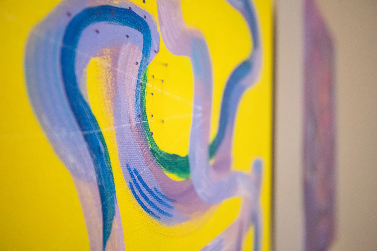An up-close view of a purple and yellow abstract Oklahoma art piece by Chandler Domingos. 