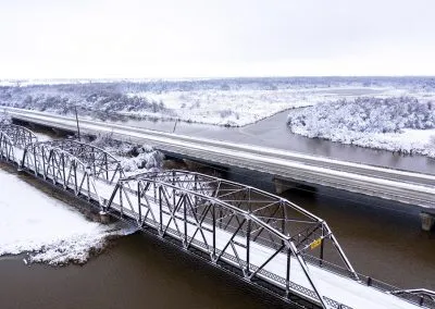 An icy, snow-covered bridge in winter.