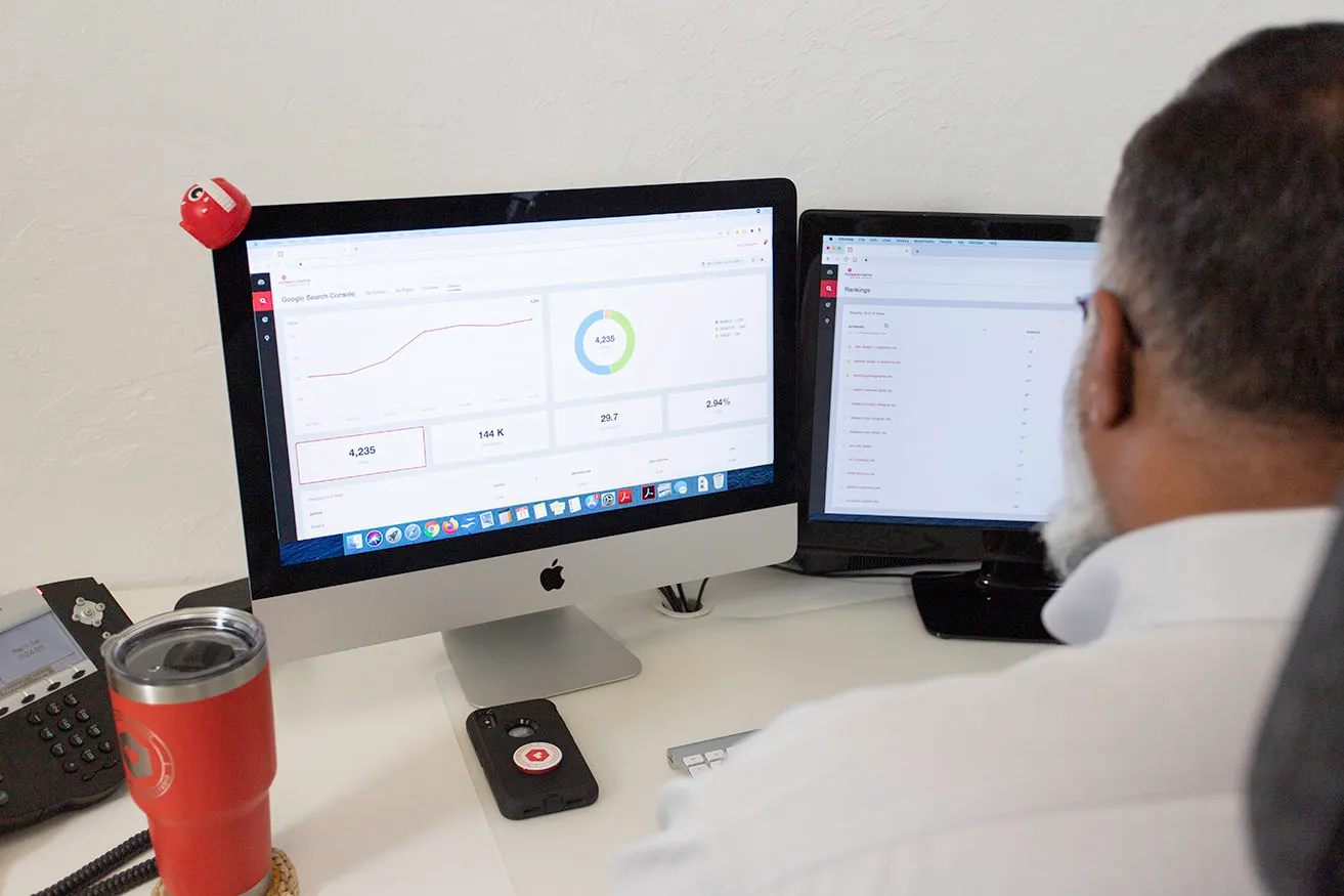 What Is the Impact of Digital Marketing on Business Growth? - myheartcreative Sam, the Operations Director, reviews a client's search engine marketing Dallas results on his desktop.