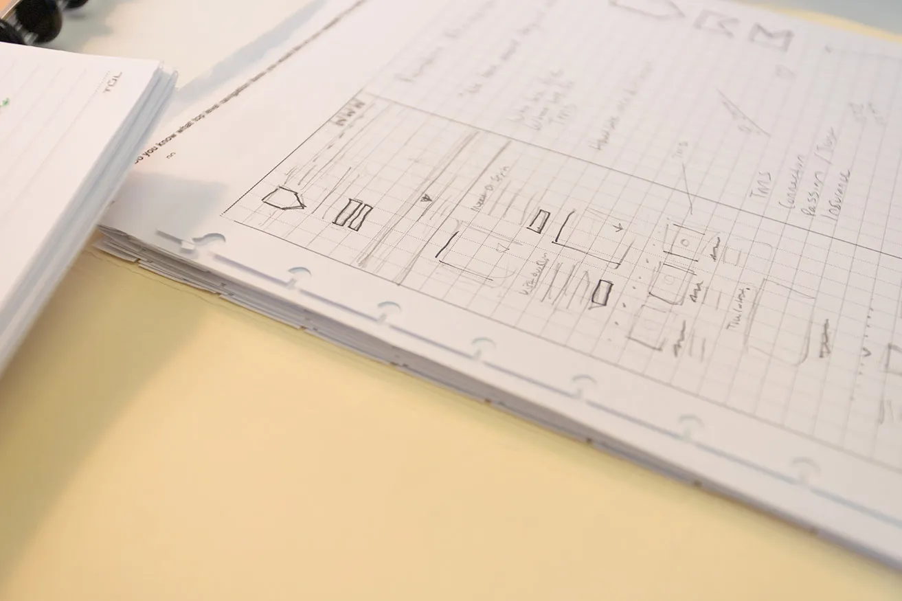 A hand-drawn sketch outlining the visual layout and hierarchy for a client's website design. 