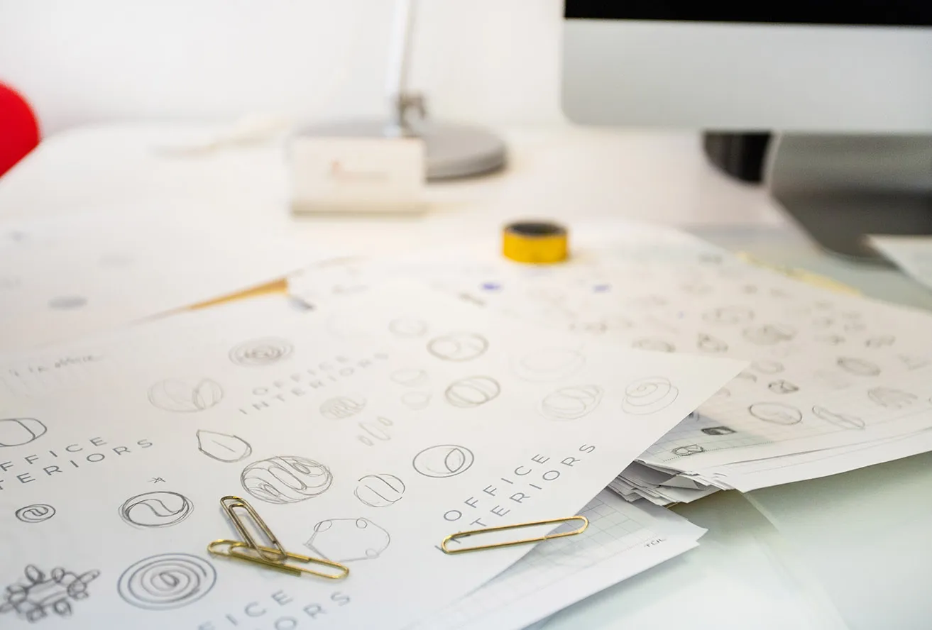 The Case for NOT Redesigning Your Logo - myheartcreative Multiple pages filled with hand-drawn sketches of a new logo for Office Interiors. Their new logo design is to reflect new branding OKC.