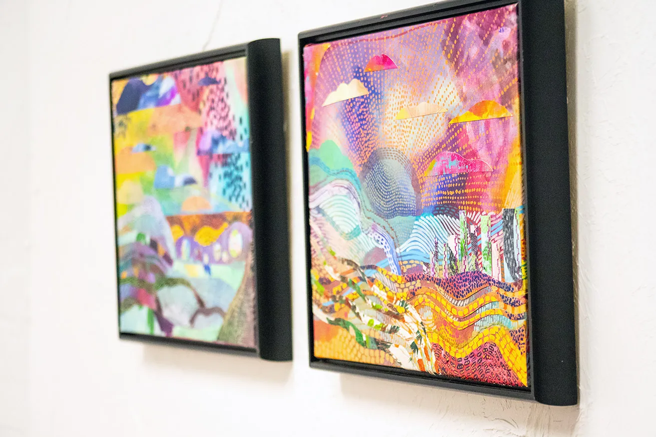Environment, Time, and Emotion - myheartcreative Two colorful, abstract landscape paintings by Faye Miller hanging side by side on a studio wall.