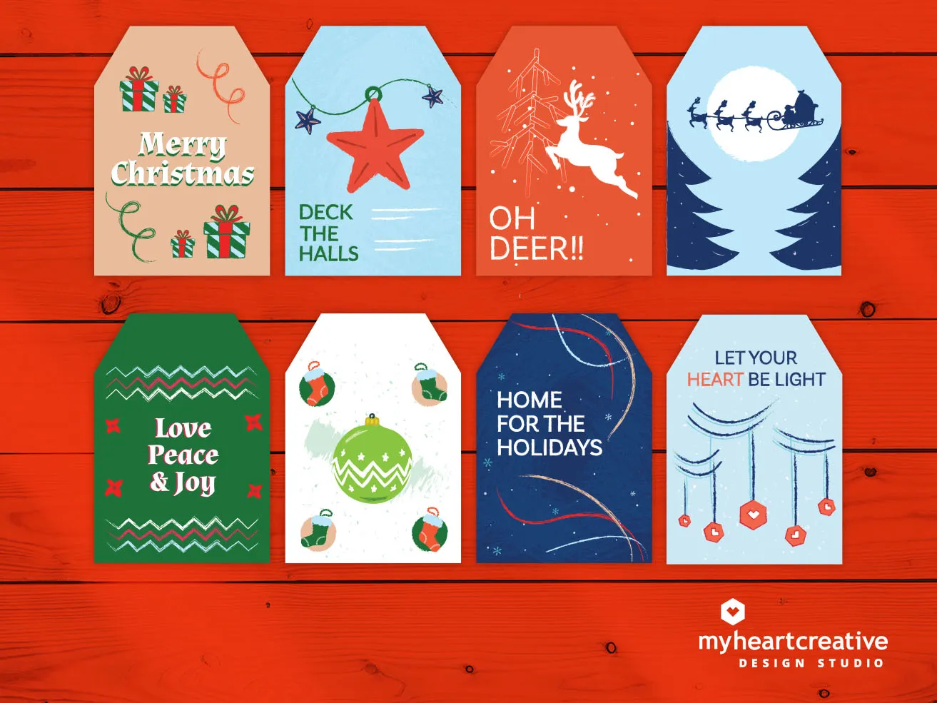 2021 Free Christmas Gift Tag Printables - myheartcreative Eight Christmas Blessings gift tag printables with custom holiday designs. Gift tag 1: "Merry Christmas" Gift tag 2: "Deck the Halls" Gift tag 3: "Oh Deer!!" Gift tag 4: Santa's sleigh flying in front of the moon. Gift tag 5: "Love, Peace, and Joy" Gift tag 6: Five ornaments Gift tag 7: "Home for the Holidays" Gift tag 8: "Let your heart be light"