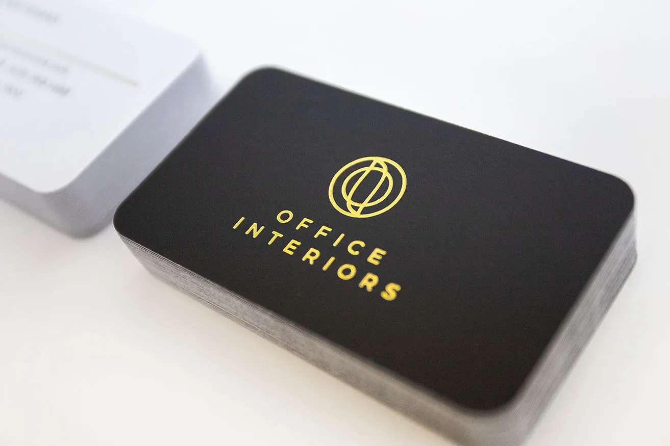 What Are the Graphic Design OKC Trends for 2021? - myheartcreative The Office Interiors business card design. The card is black, with the logo stamped in gold foil to give it a gradient illusion.