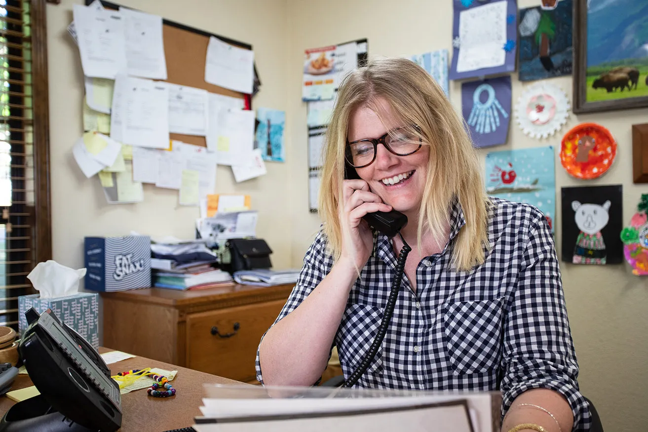 What Are the Benefits of Dallas Commercial Photography? - myheartcreative Courtney, an employee of Mountain View Meats, takes a phone call in her office for a commercial photography session.