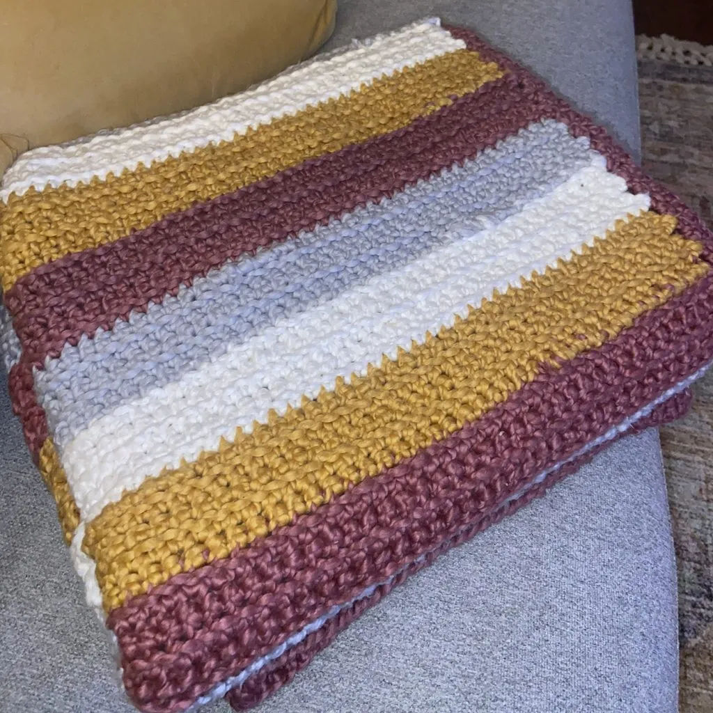 Creative New Things for Our Oklahoma Design Team - myheartcreative A grey, white, yellow, and maroon striped blanket crocheted by Kristen.