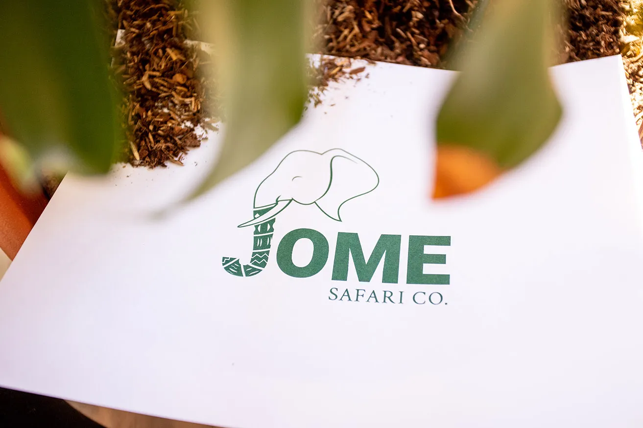 The logo for JOME Safari Co. with green font. 