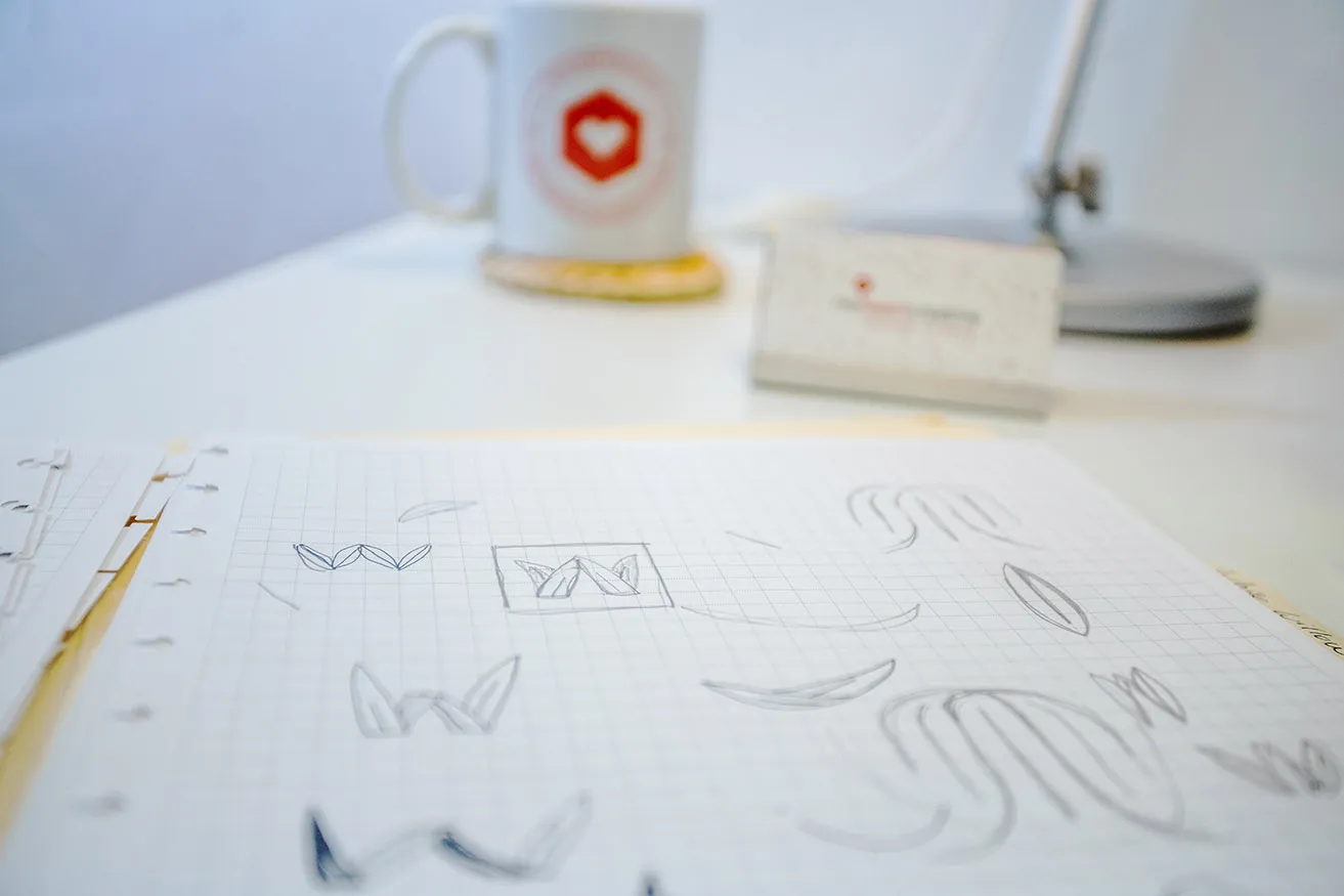 A Guide to the Monogram Design Process - myheartcreative Sketches of the logo icon for White Willow Design on paper.