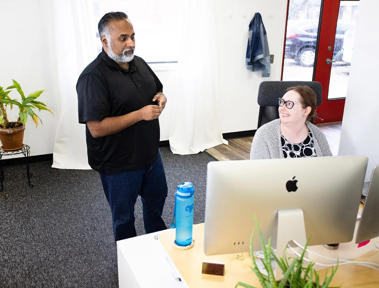April and Sam discussing blog topics for search engine marketing Dallas at the myheartcreative studio. 
