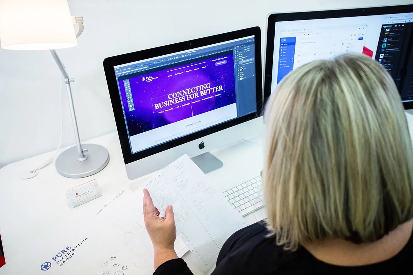A designer creates a simplistic yet purposeful homepage for PURE Distribution's new web OKC design. 