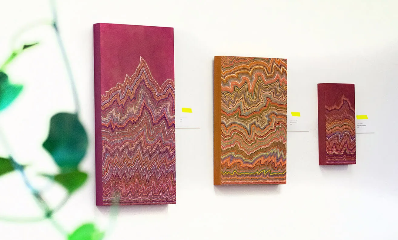 Find Artistic Inspiration. - myheartcreative Three colorful abstract pieces created by Sara Cowan that hang on the studio wall.