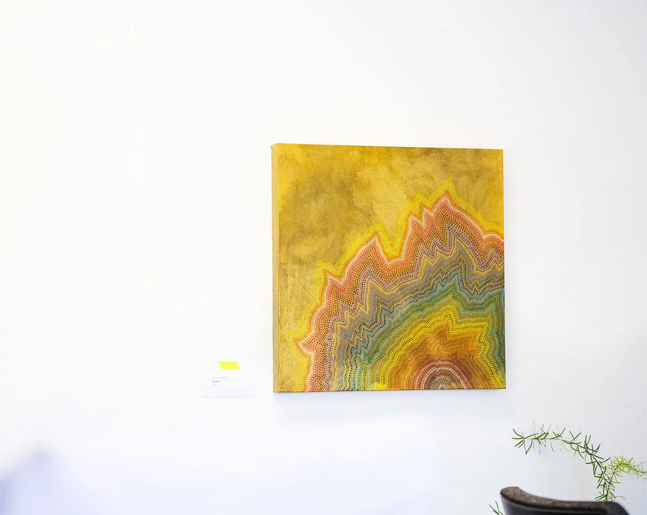 Find Artistic Inspiration. - myheartcreative A yellow multi-colored abstract painting created by Sara Cowan hangs on a wall at the myheartcreative studio.