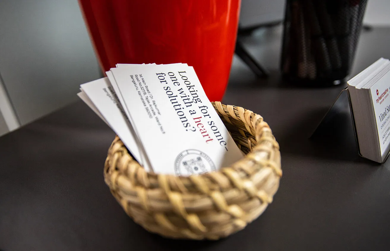 Global Branding OKC: Tips on Taking Your Brand Worldwide - myheartcreative A stack of business cards designed with Graphic Design OKC elements for myheartcreative. "Looking for someone with a heart for solutions?"