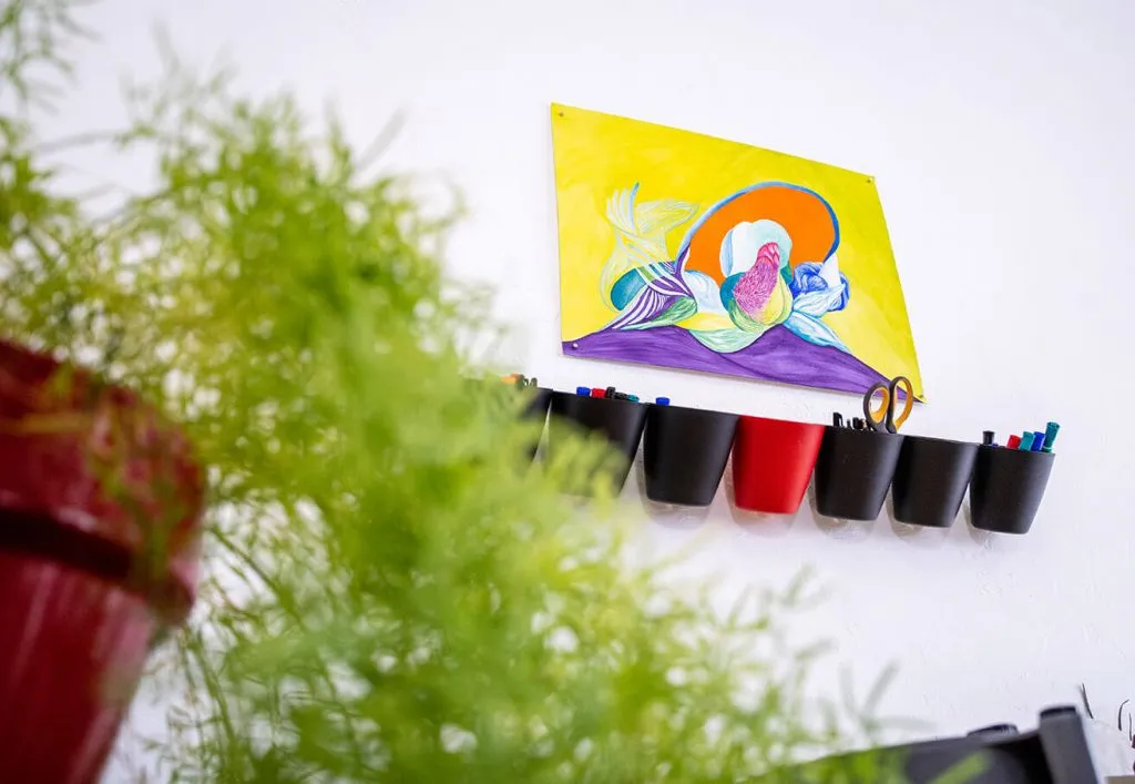 A colorful abstract art piece by an Oklahoma Artist hanging in the myheartcreative studio. 
