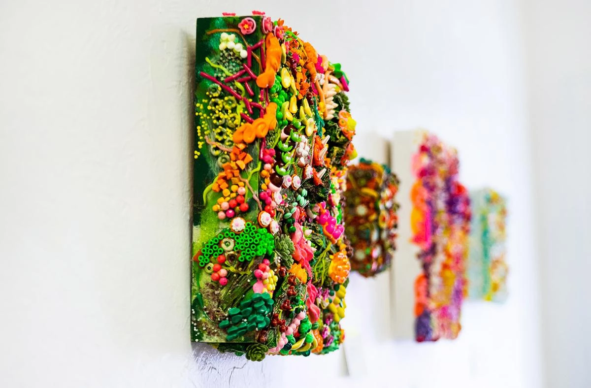 A Vision of Whimsy - myheartcreative Multiple 3D mixed media canvases are hung on the myheartcreative studio wall.