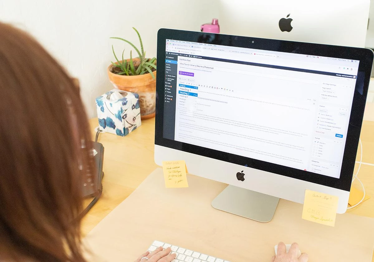 A content writer updating a post on a client's web design in Dallas. 