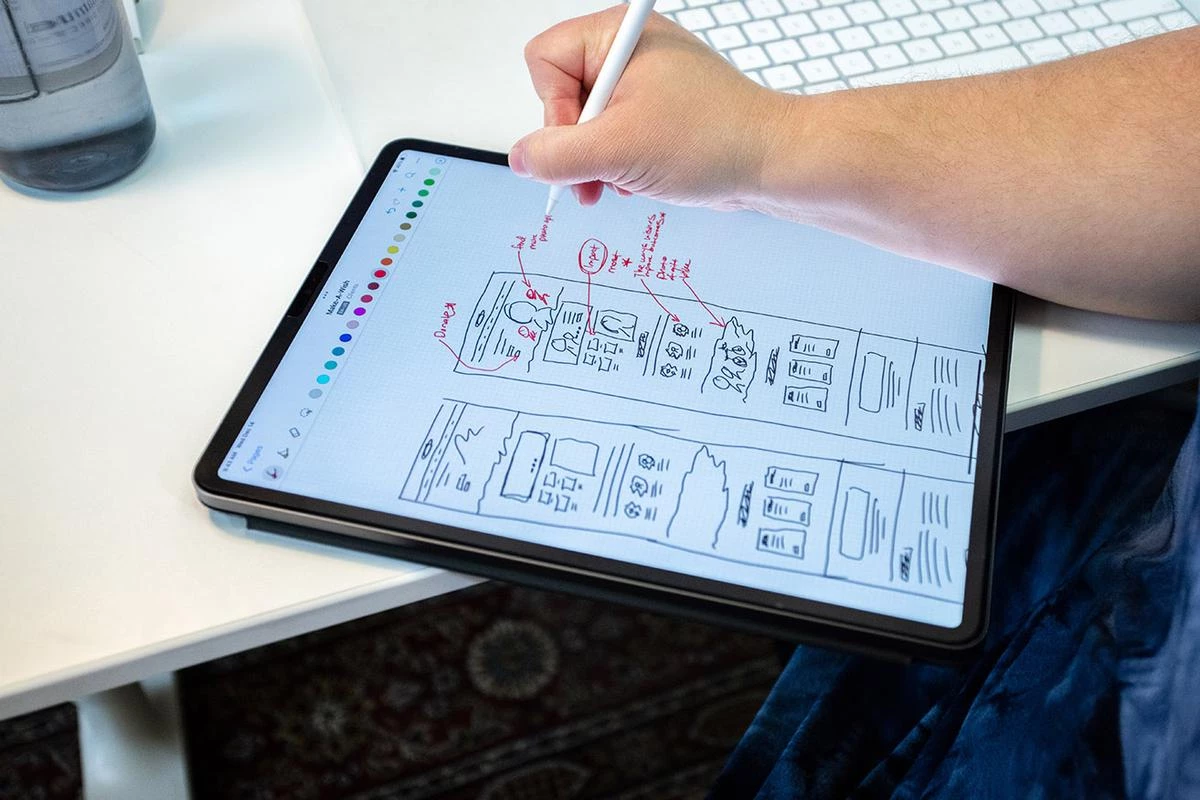 The Creative Director sketching out a website design OKC on her iPad.