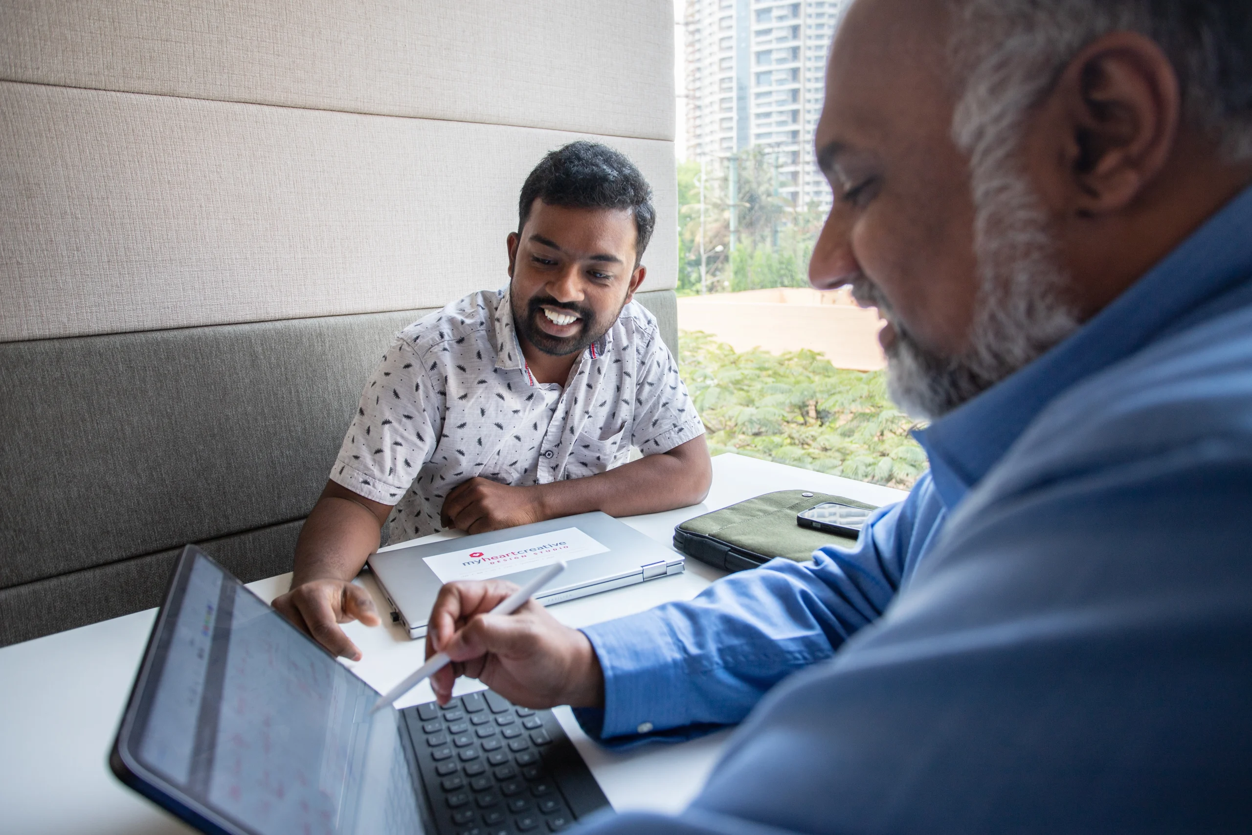 An SEO specialist and the Operations Director working on Professional Digital Marketing strategies together. 